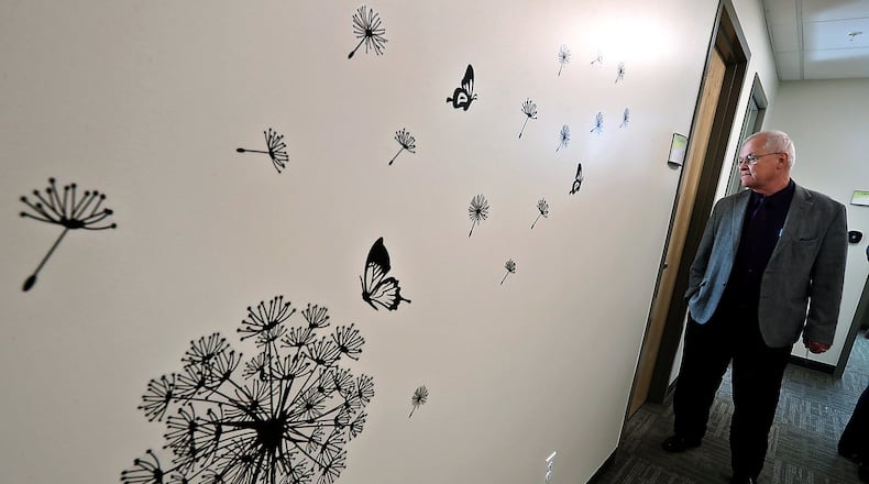 Don Warner, from Oesterlen Services for Youth, tours the new Substance Use Disorder treatment area at the Rocking Horse Center Wednesday during an open house. BILL LACKEY/STAFF