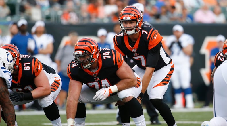 Cincinnati Bengals quarterback Jake Dolegala (7) waits for the snap by offensive tackle Keaton Sutherland (74) during the first half of an NFL preseason football game against the Indianapolis Colts, Thursday, Aug. 29, 2019, in Cincinnati. (AP Photo/Frank Victores)
