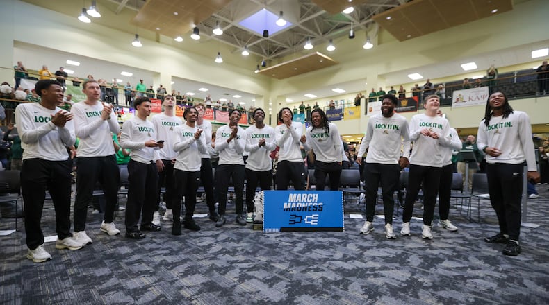 Wright State players react after the team's tournament seed and opponent was announced during an NCAA tournament selection watch party the athletic department held at the university's Student Union on Sunday, March 15 in Fairborn. BRYANT BILLING / STAFF