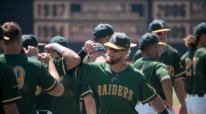 WSU junior and Northmont High School graduate Zach Weatherford celebrates with teammates after the Raiders beat UIC 10-1 in the Horizon League tournament at Nischwitz Stadium this past season. MATT HELTON / CONTRIBUTED