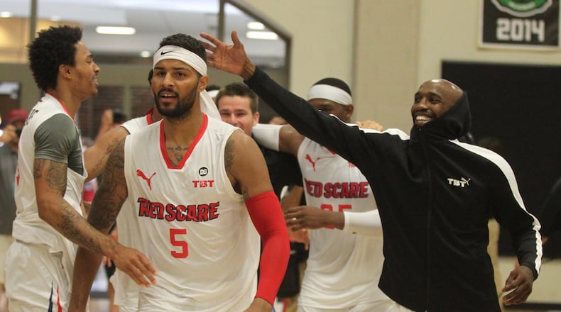 Devin Oliver and the Red Scare celebrate a victory against Mid-American Unity in the second round of The Basketball Tournament on Saturday, July 20, 2019, at Capital University in Bexley.