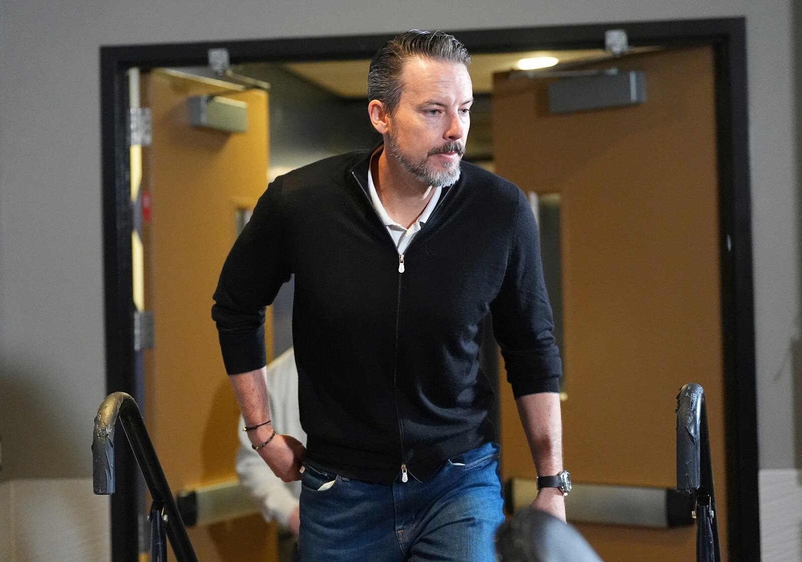 Denver Nuggets team president Josh Kroenke steps up to respond to questions at a news conference Monday, April 14, 2025, in Denver to questions about the firing of the team's general manager and head coach last week. (AP Photo/David Zalubowski)