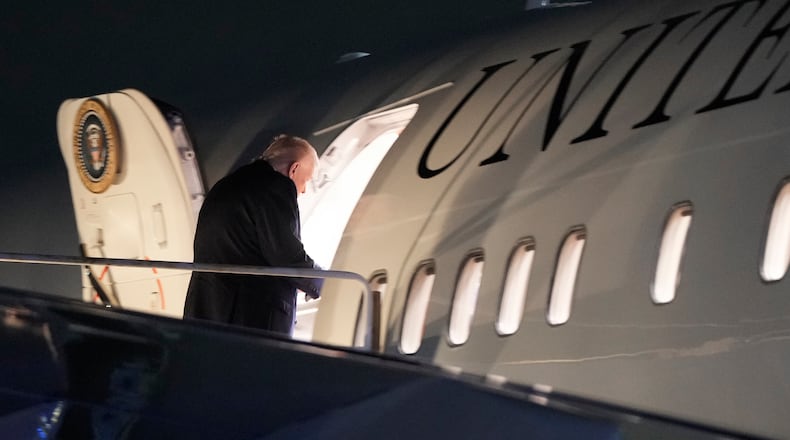 President Donald Trump boards Air Force One at Palm Beach International Airport, Sunday, Jan. 11, 2026, in West Palm Beach, Fla. (AP Photo/Julia Demaree Nikhinson)