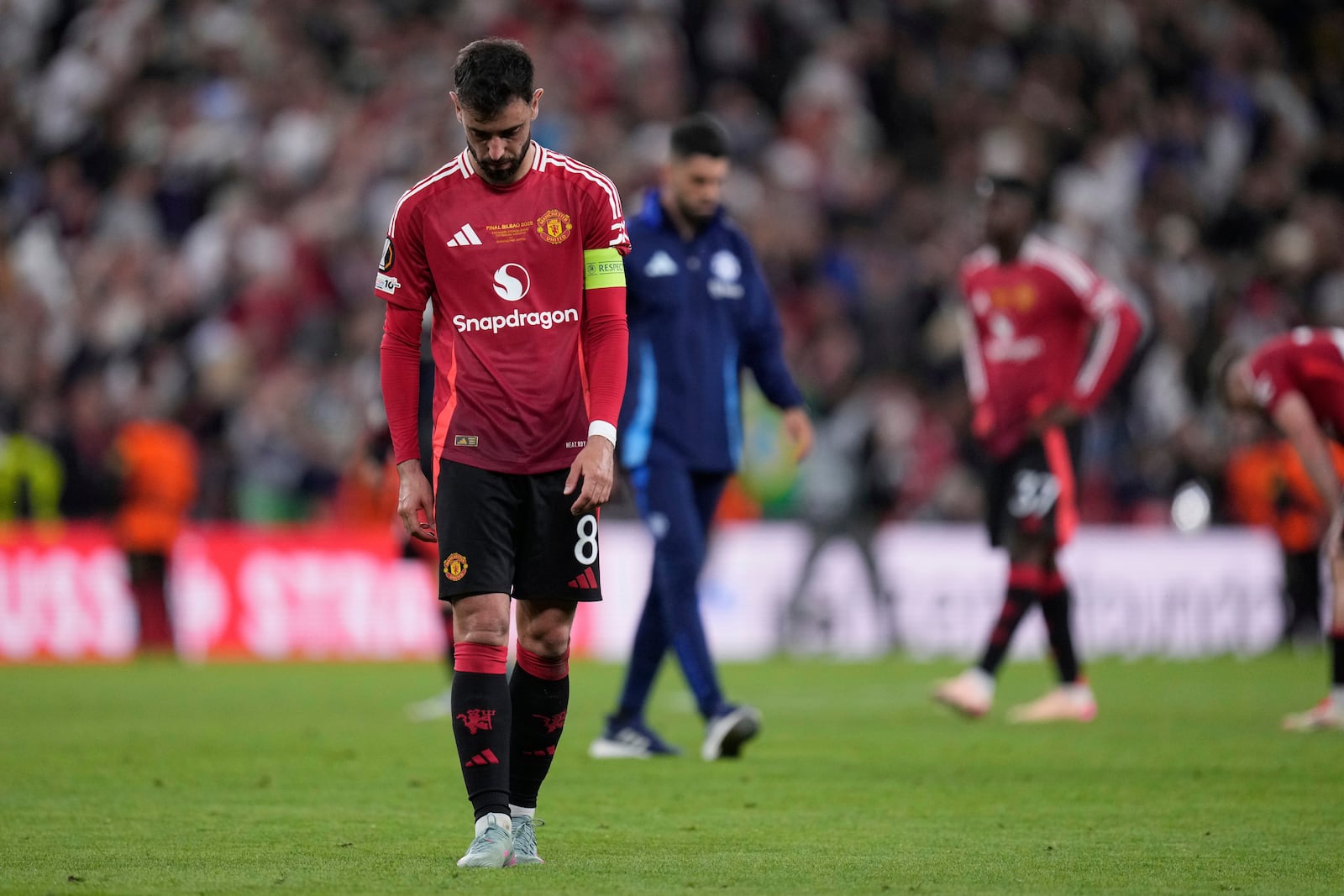 Manchester United's Bruno Fernandes react at the end of the Europa League final soccer match between Tottenham Hotspur and Manchester United at the San Mames Stadium in Bilbao, Spain, Wednesday, May 21, 2025. (AP Photo/Bernat Armangue)