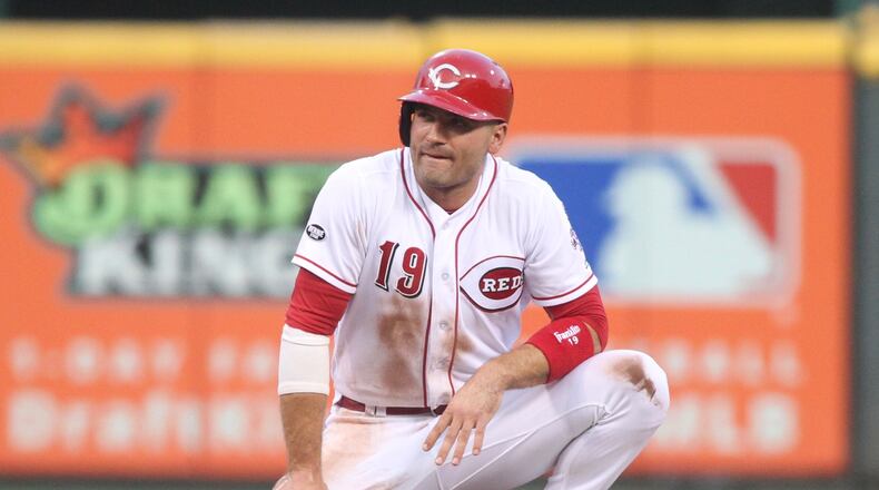 The Reds' Joey Votto pauses after sliding back into second base against the Cardinals on Tuesday, Aug. 2, 2016, at Great American Ball Park in Cincinnati. David Jablonski/Staff
