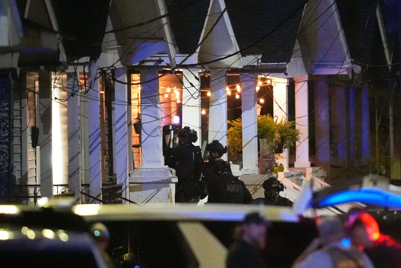 FILE - Louisiana state police enter a house on North Galvez street as they pursue a fugitive that escaped from a New Orleans jail, Tuesday, May 20, 2025, in New Orleans. (AP Photo/Gerald Herbert, File)