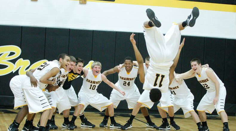 Shane Satterfield (11) of Shawnee does a flip in celebration of Friday night's 66-47 win over Tippecanoe on Feb. 8, 2013. Barbara J. Perenic/Staff