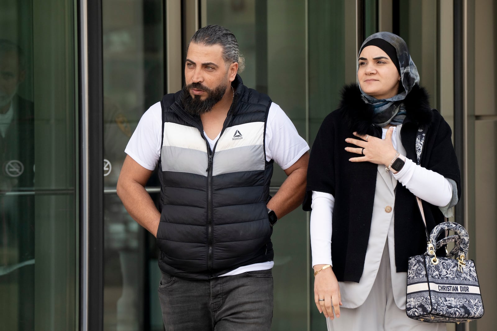 Odai Al Fayoumi, left, father of Wadee Al Fayoumi, who was murdered by Joseph Czuba in 2023, walks out of the Will County Courthouse after the sentencing of Czuba in Joliet, Ill., Friday, May 2, 2025. (Pat Nabong /Chicago Sun-Times via AP)