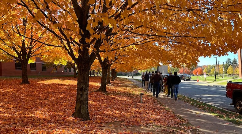 People walk along a sidewalk at Central State University campus on Oct. 24, 2024. The university recently reported it has about $26 million in unpaid tuition and fees that is more than a year past due. THOMAS GNAU/STAFF