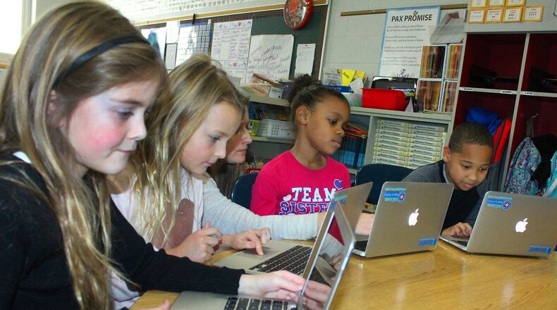Snow Hill second graders use computers in a classroom. JEFF GUERINI/ STAFF PHOTO