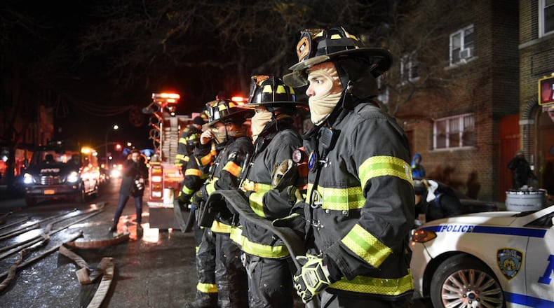 Firefighters at the scene of a deadly fire on in New York last December. A bill that passed the U.S. Senate last week would create a voluntary database of firefighters who contract cancer. The House approved a similar version of the bill last year. (David Dee Delgado/The New York Times)