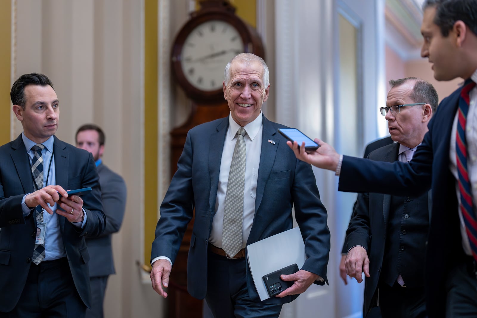FILE — Sen. Thom Tillis, R-N.C., speaks with reporters as he heads to the chamber during a test vote to begin debate on a border security bill, at the Capitol in Washington, Feb. 7, 2024. (AP Photo/J. Scott Applewhite, File)