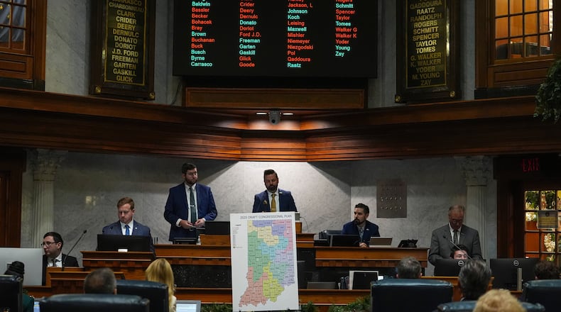 Indiana Lt. Gov. Micah Beckwith announces the results of a vote to redistrict the state's congressional map, Thursday, Dec. 11, 2025, at the Statehouse in Indianapolis. (AP Photo/Michael Conroy)