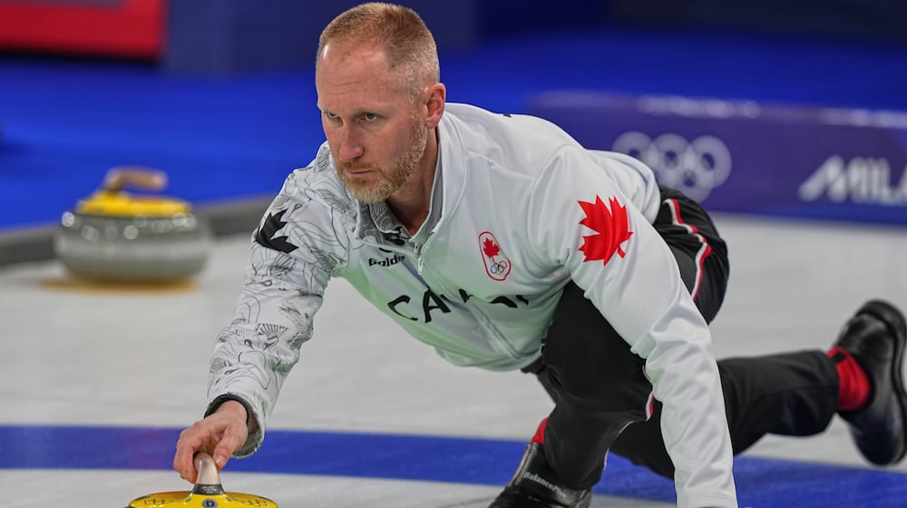 Canada's Brad Jacobs in action during the men's curling round robin session against Norway at the 2026 Winter Olympics, in Cortina d'Ampezzo, Italy, Thursday, Feb. 19, 2026. (AP Photo/Fatima Shbair)