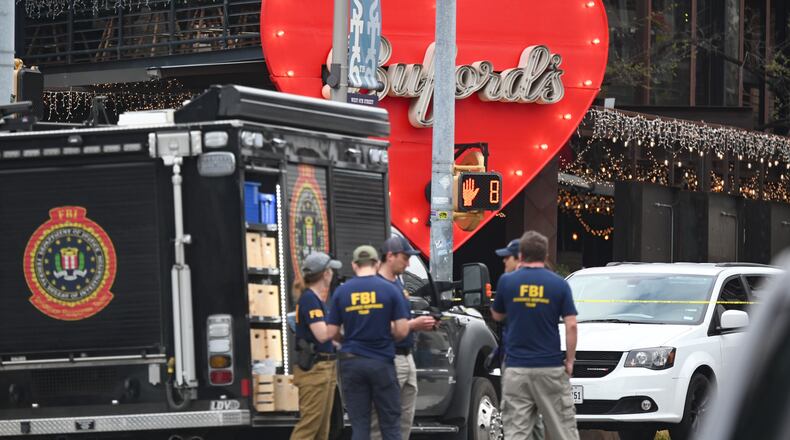 The Austin Police Department and the FBI investigate a shooting at Buford's on 6th Street on Sunday, March 1, 2026, in Austin, Texas. (AP Photo/Jack Myer)