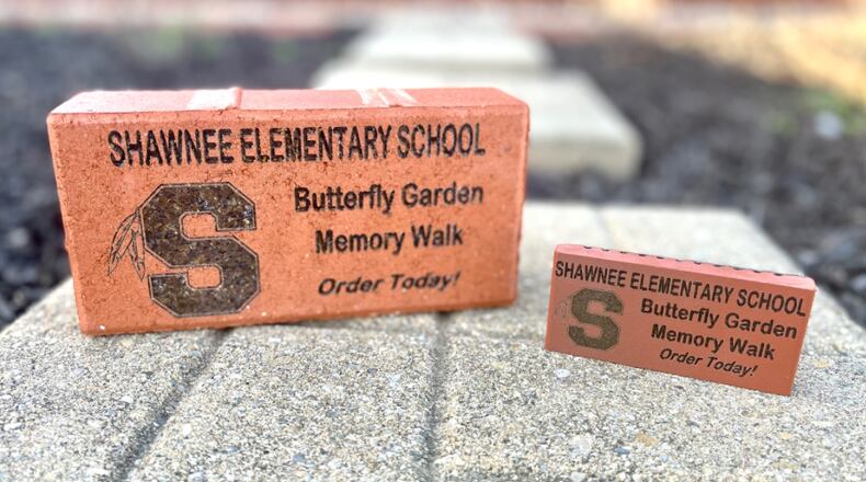 An example of the Clark-Shawnee Elementary Memory Walk brick and replica available for purchase. These 4” by 8” logo bricks can be personalized with up to three lines of text to honor, celebrate, thank, or remember a loved one, family, organization, special occasion, and more. You may also choose to add clip art representing Possum, Reid, Rockway, Clark-Shawnee, a butterfly, or a heart. Contributed/Clark-Shawnee Local Schools