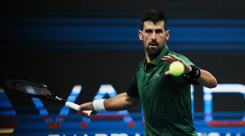 FILE - Novak Djokovic, of Serbia, plays a shot against Yannick Hanfmann, of Germany, during the ATP250 tournament semifinal tennis match in Athens, Greece, Nov. 7, 2025. (AP Photo/Thanassis Stavrakis, File)
