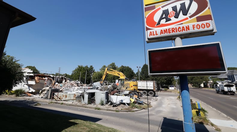 The Long John Silver’s/A&W Root Beer restaurant on Limestone just north of downtown Springfield is closed, and crews were demolishing the building on Monday, Sept. 9, 2024. BILL LACKEY / STAFF