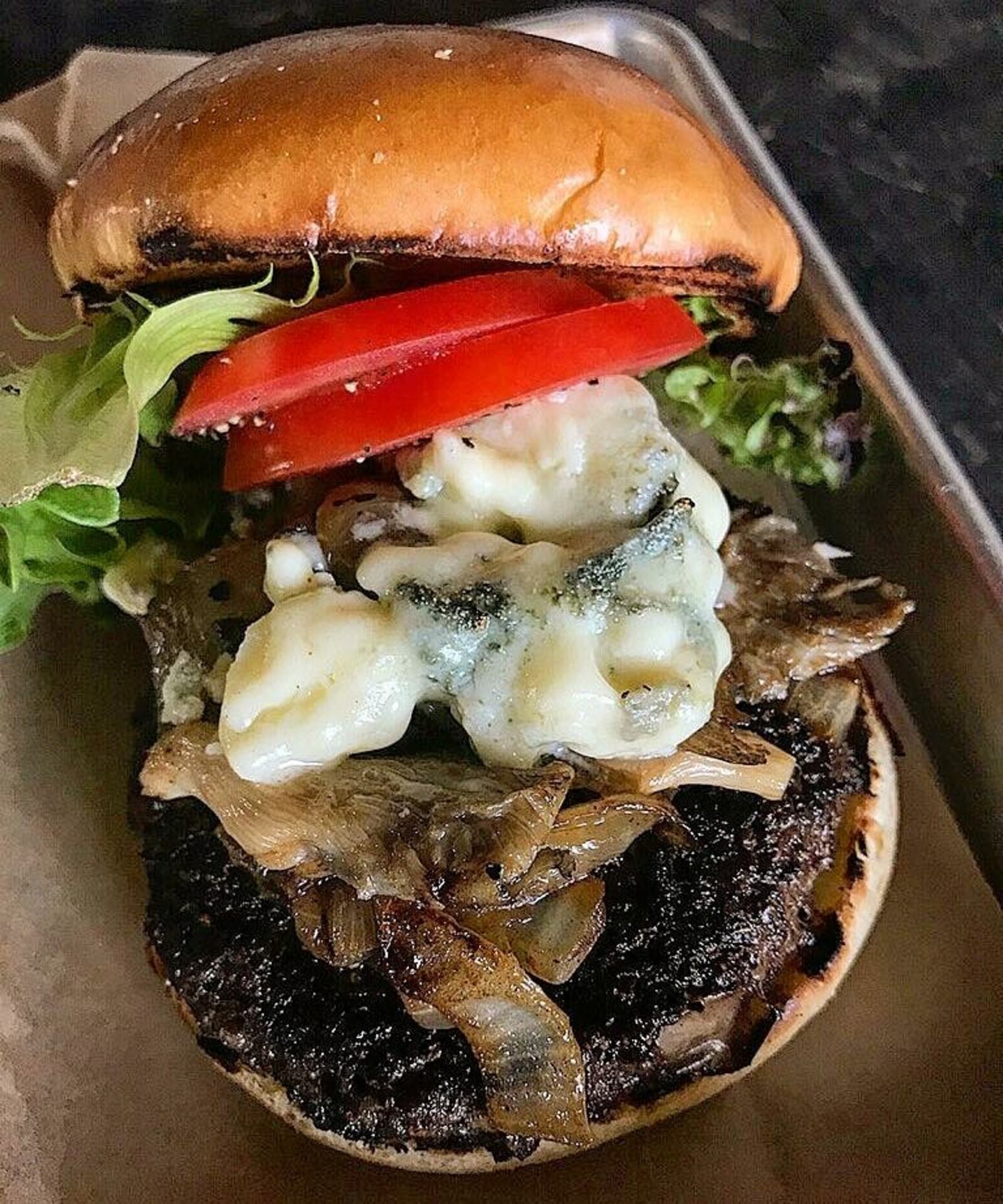 Mudlick Tap House in downtown Dayton plans to offer three burgers as part of Dayton Burger Week 2018:  its signature Black Hawk Farms wagyu beef burger,  its white bean tabbouleh burger and one created by the winner of a social media contest that comes with a pair of tickets to the Bonnaroo Music and Arts Festival.