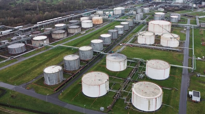 Big oil tanks are pictured in front of the BP refinery in Gelsenkirchen, one of the biggest fuel producers in Germany, Wednesday, March 11, 2026. (AP Photo/Martin Meissner)