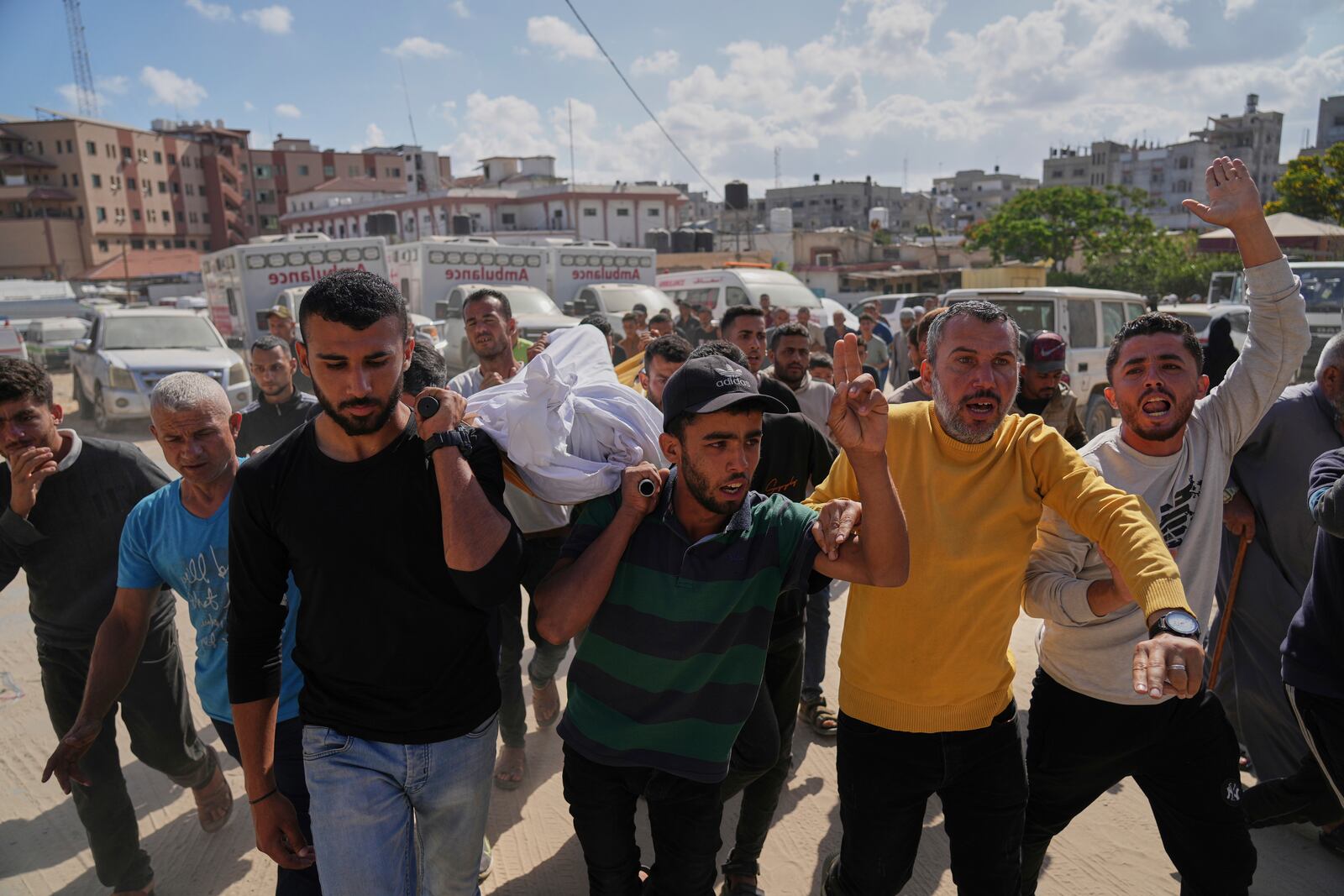 Palestinians carry the body of Hosam Wafi who, according to family members, was killed in an Israeli strike, during his funeral in Khan Younis, southern Gaza Strip, Monday, June 2, 2025. (AP Photo/Abdel Kareem Hana)