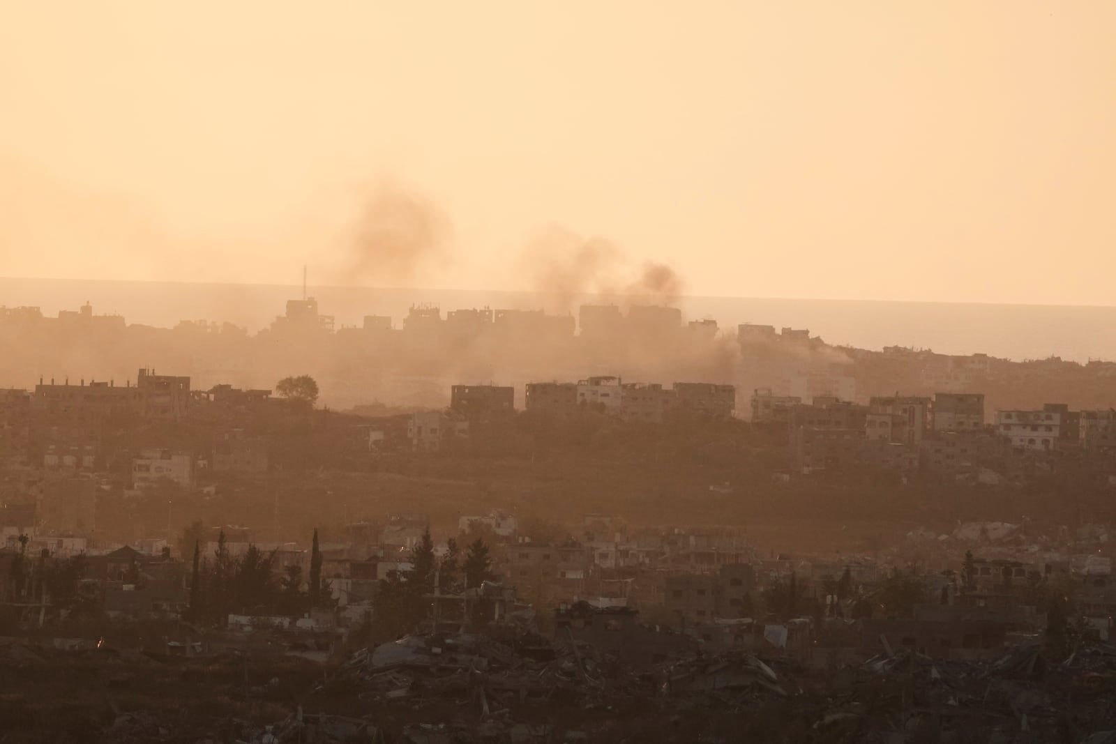 Smoke rises following an Israeli army bombardment in Gaza Strip, seen from southern Israel, Tuesday, May 20, 2025. (AP Photo/Maya Alleruzzo)