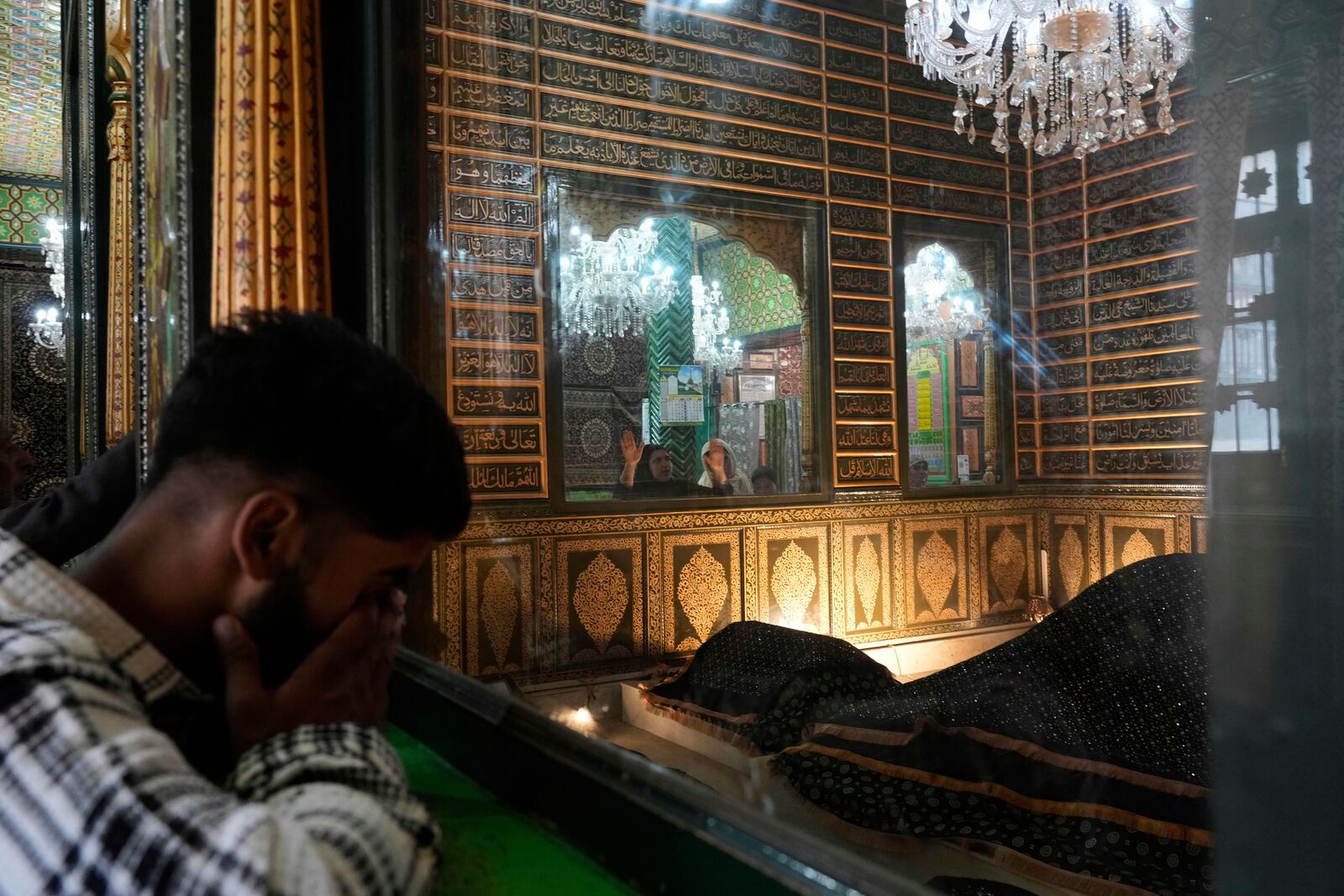 Kashmiri Muslims pray inside the shrine of Sheikh Abdul Qadir Jeelani, commonly known as Dastageer Sahib, in Srinagar, Indian controlled Kashmir, Wednesday, April 2, 2025. (AP Photo/Mukhtar Khan)