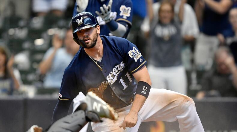 MILWAUKEE, WISCONSIN - JUNE 30: Mike Moustakas #11 of the Milwaukee Brewers scores in the fourth inning against the Pittsburgh Pirates at Miller Park on June 30, 2019 in Milwaukee, Wisconsin. (Photo by Quinn Harris/Getty Images)