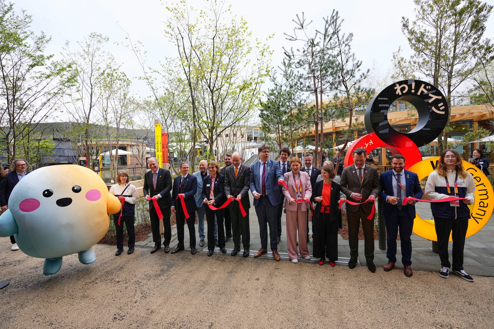 Officials participate in the opening of Germany's pavilion on the opening day of the Expo 2025 in Osaka, central Japan, Sunday, April 13, 2025. (AP Photo/Hiro Komae)