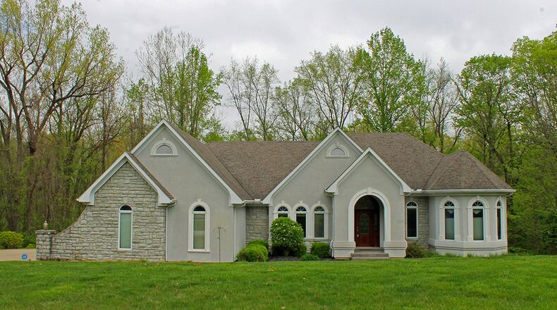 The 5-bedroom home has about 5,130 sq. ft. of living space with a 3-car garage. There is also a 4-season room in back ad a theater room in the finished lower level. CONTRIBUTED PHOTO BY VICKIE KAPNAS