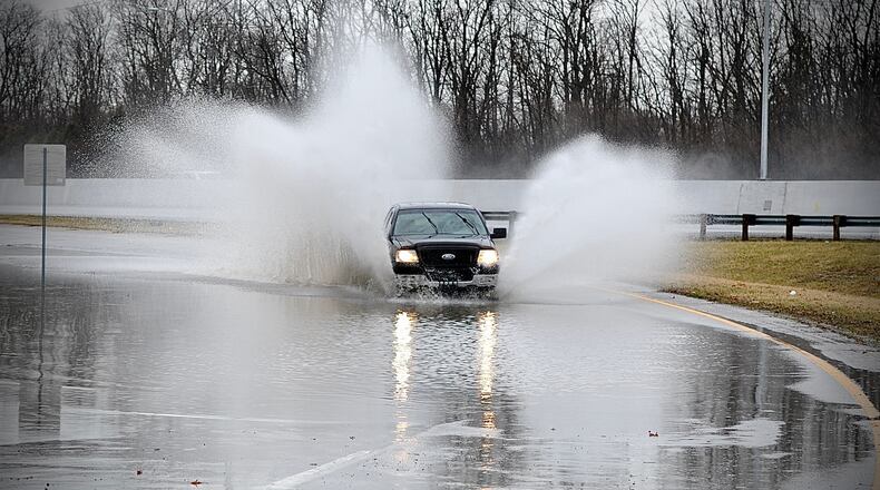 Water covered the exit ramp from U.S. 35 East onto Dayton Xenia Road Monday morning March 7, 2022. MARSHALL GORBY \STAFF