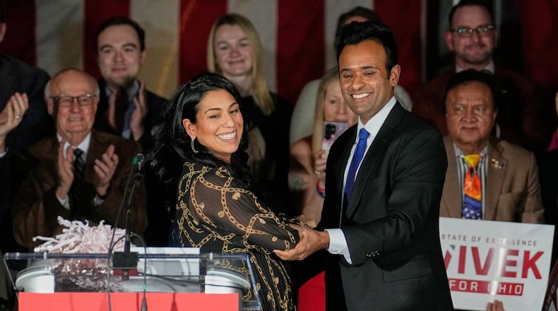 Apoorva Ramaswamy, left, greets her husband, Vivek Ramaswamy, right, a Republican candidate for governor of Ohio, at a rally Wednesday, Jan. 7, 2026, in Cleveland. (AP Photo/Sue Ogrocki)