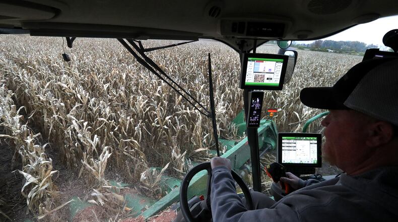 Clark County farmer Brian Harbage operates a combine as he harvests a corn field Tuesday, Oct. 27, 2020. BILL LACKEY/STAFF
