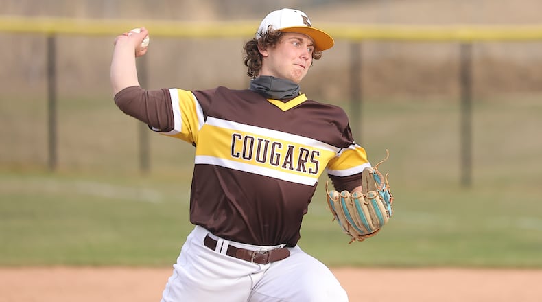 Cutline: Kenton Ridge High School senior Evan Houseman pitches during their scrimmage game against Oakwood on Monday, March 22 at Tom Randall Field in Springfield. Michael cooper/CONTRIBUTED