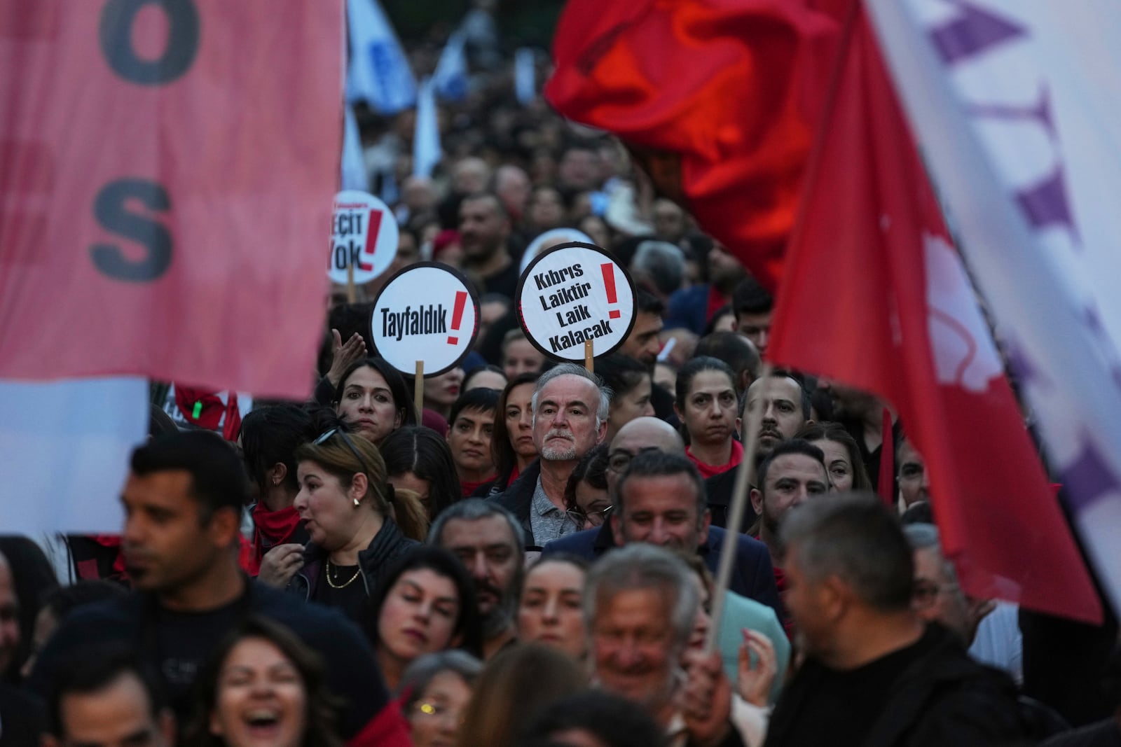 Several thousand Turkish Cypriots took to the streets of the northern half of ethnically divided Cyprus' capital Nicosia to protest what they say is Turkey's attempt to erode their secular roots and to strengthen the hold of political Islam over their society, on Friday, May 2, 2025. (AP Photo/Petros Karadjias)