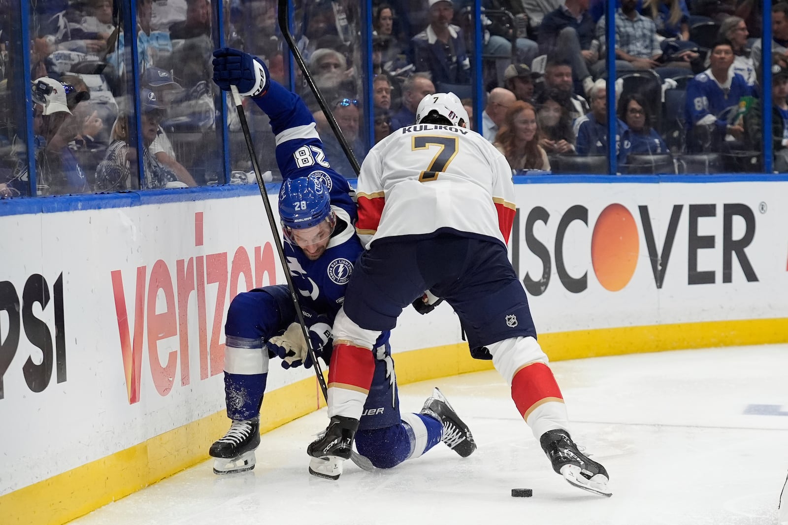Florida Panthers defenseman Dmitry Kulikov (7) takes down Tampa Bay Lightning center Zemgus Girgensons (28) during the second period in Game 5 of an NHL hockey Stanley Cup first-round playoff series, Wednesday, April 30, 2025, in Tampa, Fla. (AP Photo/Chris O'Meara)