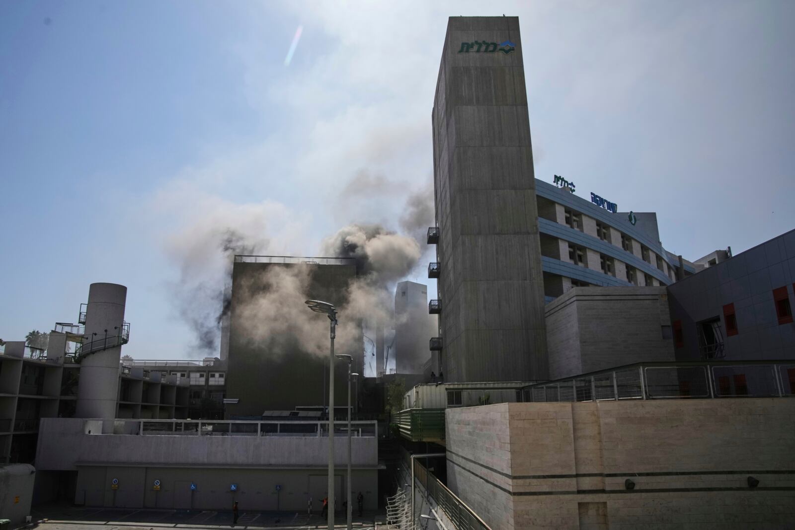Smokes raises from a building of the Soroka hospital complex after it was hit by a missile fired from Iran in Be'er Sheva, Israel, Thursday, June 19, 2025. (AP Photo/Leo Correa)