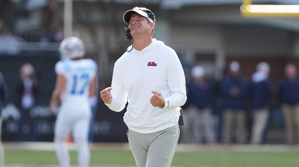 Mississippi head coach Lane Kiffin reacts to a official's call during the second half of an NCAA college football game against Mississippi State, Friday, Nov. 28, 2025, in Starkville, Miss. (AP Photo/Rogelio V. Solis)