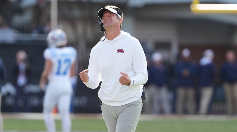 Mississippi head coach Lane Kiffin reacts to a official's call during the second half of an NCAA college football game against Mississippi State, Friday, Nov. 28, 2025, in Starkville, Miss. (AP Photo/Rogelio V. Solis)