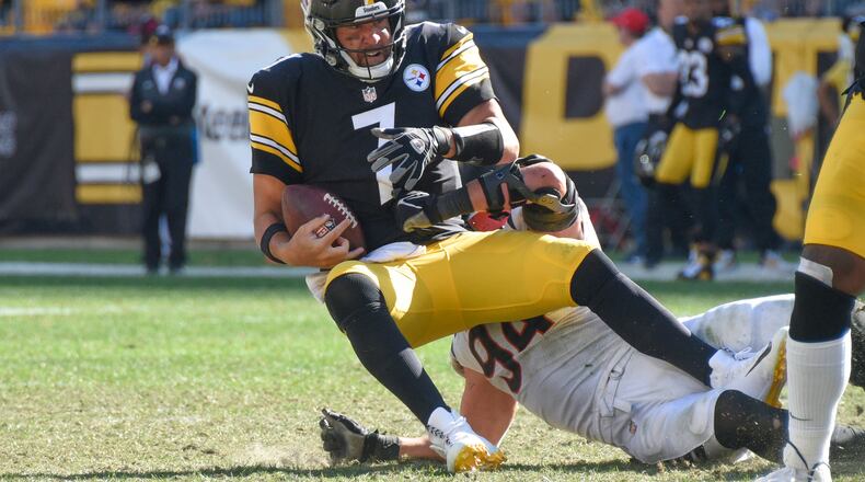 Pittsburgh Steelers quarterback Ben Roethlisberger (7) is sacked by Cincinnati Bengals defensive end Sam Hubbard (94) during the second half an NFL football game, Sunday, Sept. 26, 2021, in Pittsburgh. (AP Photo/Don Wright)