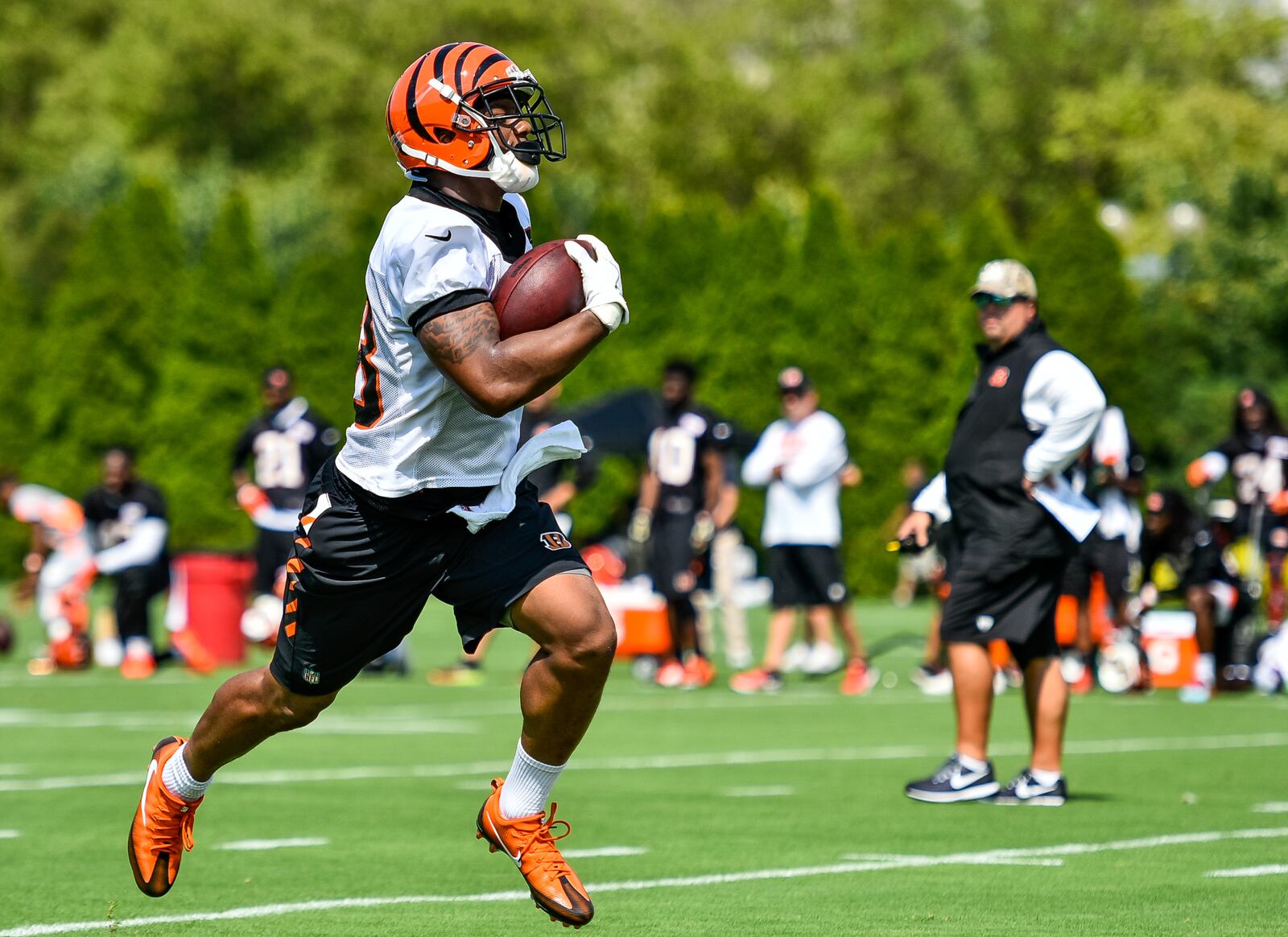 Running back Joe Mixon carries the ball during the first day of Cincinnati Bengals Training Camp Friday, July 28 at the practice fields beside Paul Brown Stadium in Cincinnati. NICK GRAHAM/STAFF