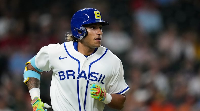 Brazil's Lucas Ramirez runs the bases after hitting a solo home run during the first inning of a World Baseball Classic game, Friday, March 6, 2026, in Houston. (AP Photo/Ashley Landis)