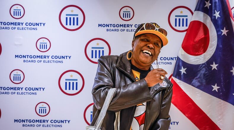 After voting early at the Montgomery County Board of Elections, Darla Jackson-Jones is photographed by Jeff Hoagland, not pictured, on Friday April 28, 2023. JIM NOELKER/STAFF