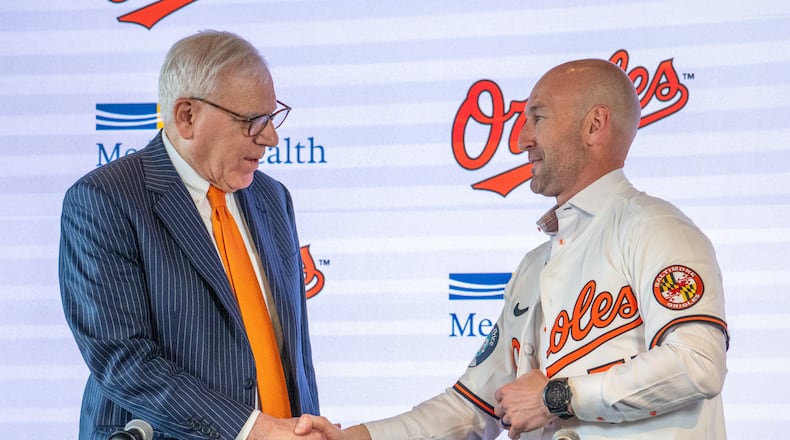 Baltimore Orioles majority owner David Rubenstein, left, congratulates the baseball club's new manager Craig Albernaz during a news conference, Tuesday, Nov. 4, 2025, in Baltimore. (Jerry Jackson/The Baltimore Banner via AP)