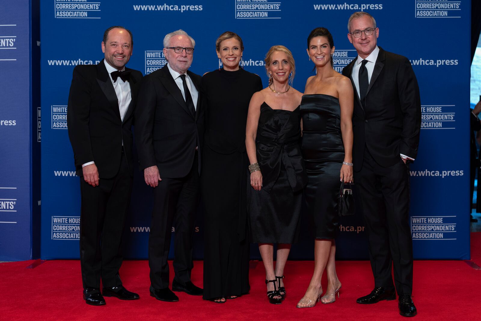 From left; Phil Rucker, Wolf Blitzer, Pamela Brown, Dana Bash, Kaitlan Collins and Jeff Zeleny pose for photographers as they arrive at the annual White House Correspondents' Association Dinner in Washington, Saturday, April 26, 2025. (AP Photo/Jose Luis Magana)