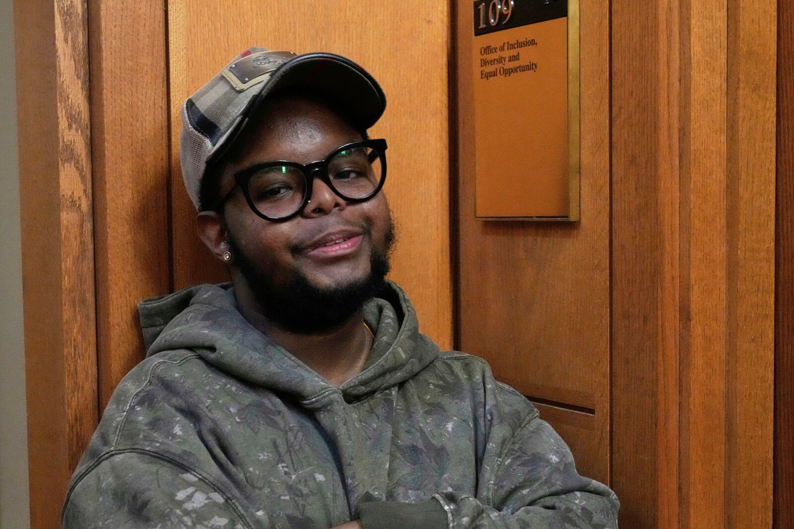 Case Western Reserve University student. Justen Pippens poses for a photo outside the recently closed Office of Inclusion, Diversity and Equal Opportunity at the school In Cleveland Thursday, April 17, 2025. (AP Photo/Sue Ogrocki)