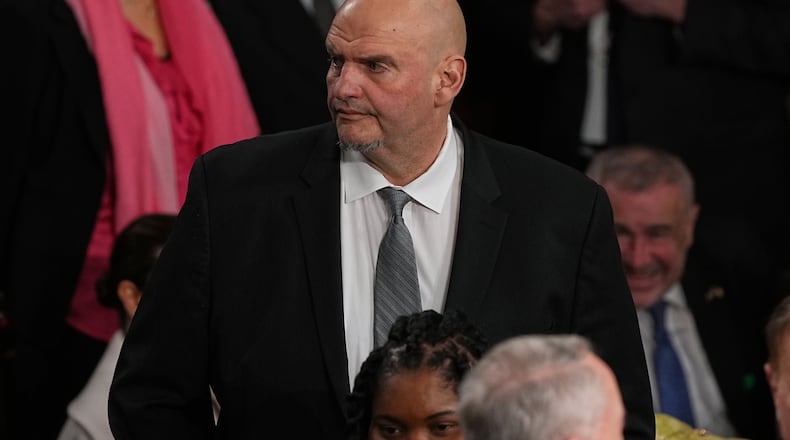 Sen. John Fetterman, D-Pa., arrives before President Donald Trump delivers the State of the Union address to a joint session of Congress in the House chamber at the U.S. Capitol in Washington, Tuesday, Feb. 24, 2026. (AP Photo/Matt Rourke)