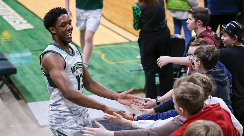 Wright State guard Solomon Callaghan claps hands with fans after a 93-83 victory over Youngstown State on Thursday, Jan. 15 at Ervin J. Nutter Center in Fairborn. BRYANT BILLING/STAFF