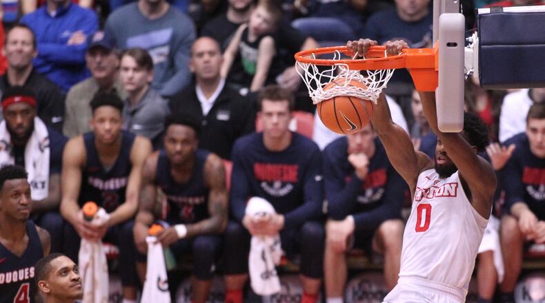 Dayton’s Josh Cunningham dunks against Duquesne on Wednesday, Feb. 7, 2018, at UD Arena. David Jablonski/Staff