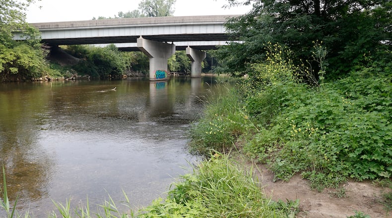 The Mad River flows under Troy Road at the end of West 1st Street in Springfield Monday, July 17, 2023. BILL LACKEY/STAFF